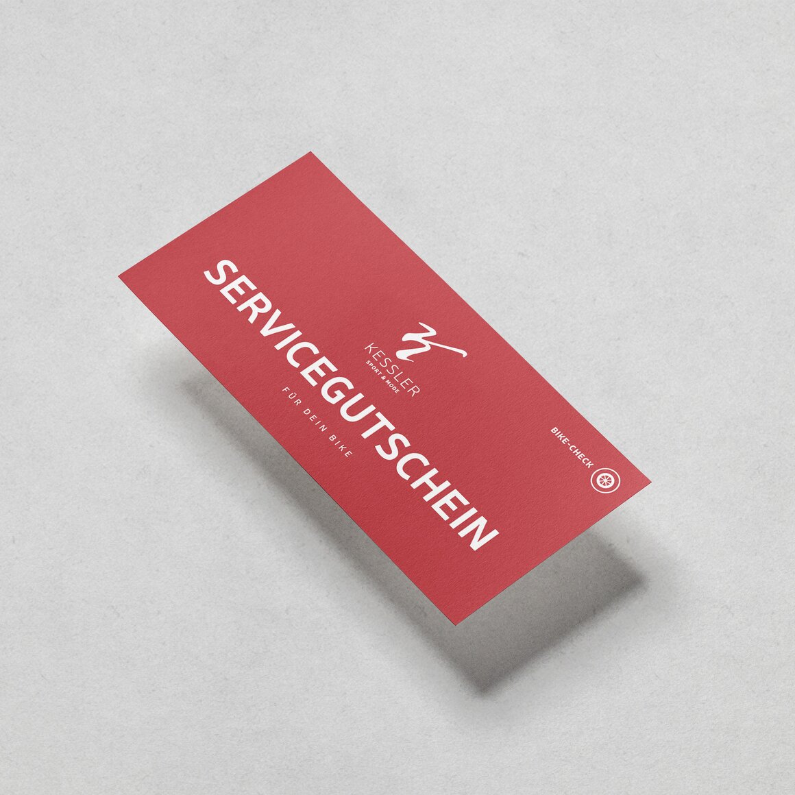 Red service voucher for a bike check. © Sport Kessler GmbH
