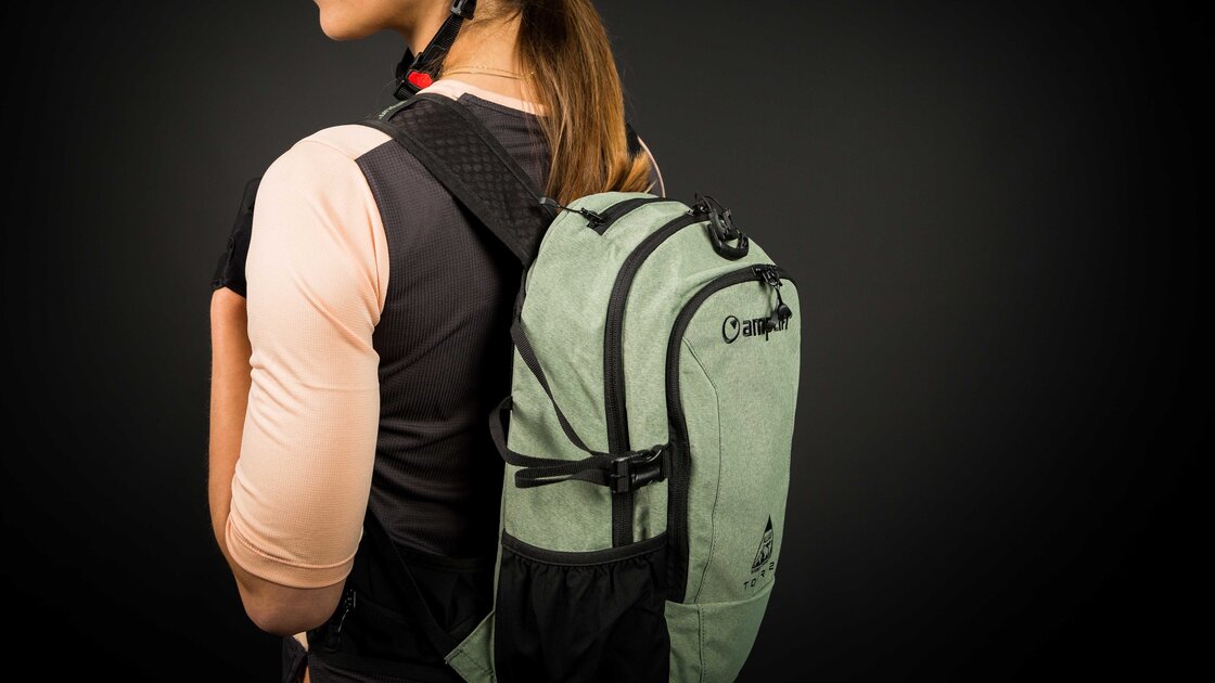 Woman wearing a cycling helmet and backpack. © Sport Kessler GmbH