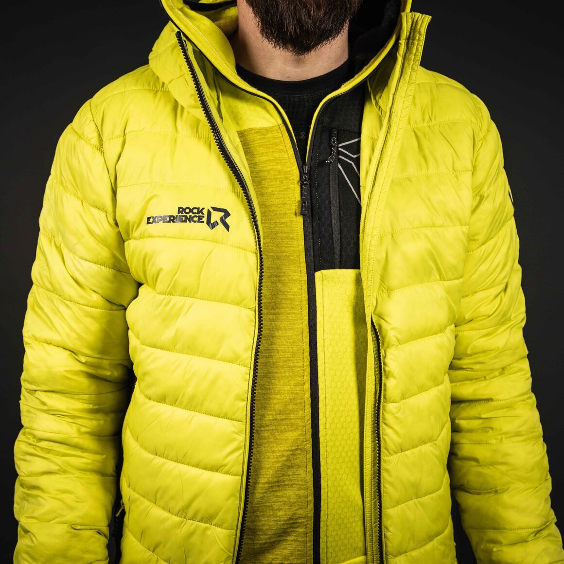 Man wearing a bright yellow quilted jacket. © Sport Kessler GmbH